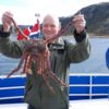 A man holds king crab