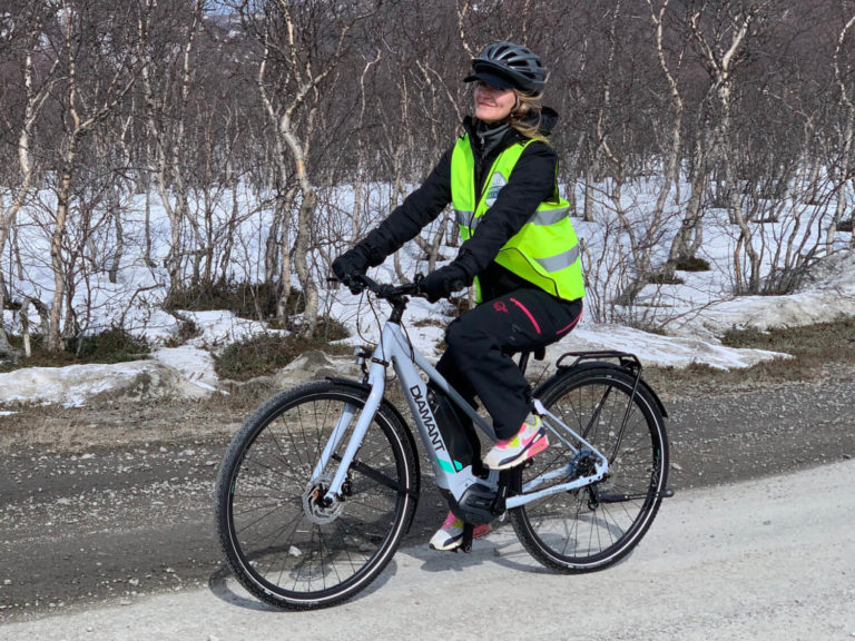 Woman riding electric bicycle