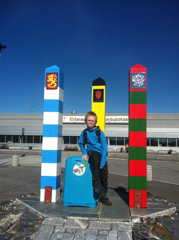 A boy posing in the front of the Kirkenes Høybuktmoen Airport
