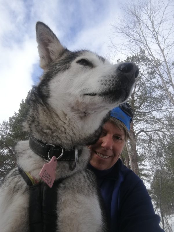 A woman and a husky