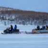 Snowmobile and sledge
