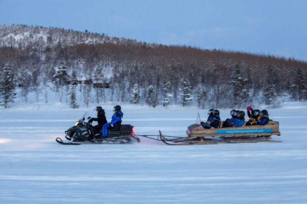 Snowmobile and sledge