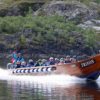 Tourists ride a river boat
