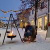 2 woman sit by the fire